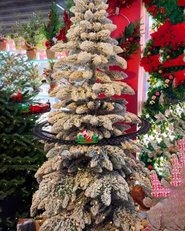 Flocked Christmas tree with train ride
